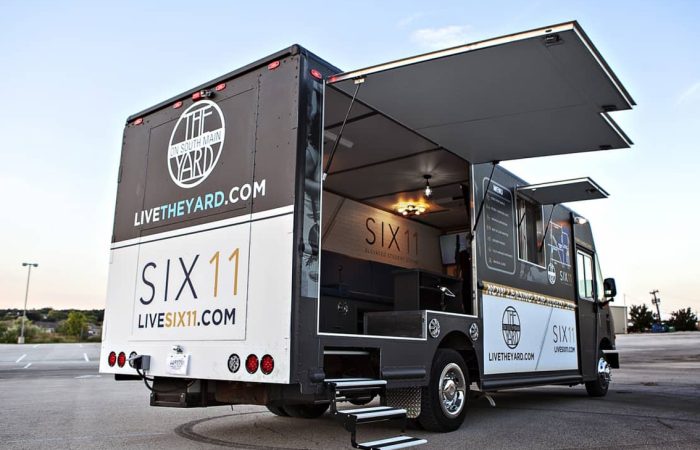 Six11 & The Yard Student Living Mobile Office Truck is custom built by Cruising Kitchens for Campus Apartments serving the University of Michigan. It's definitely not your average mobile office experience – equipped with a high-end TV/audio system, this Mobile Office truck offers an interactive and inviting atmosphere for potential residents. Six11 & The Yard is smart living for the students, and this mobile office truck is indicative of the level of quality they offer within their off-campus communities.