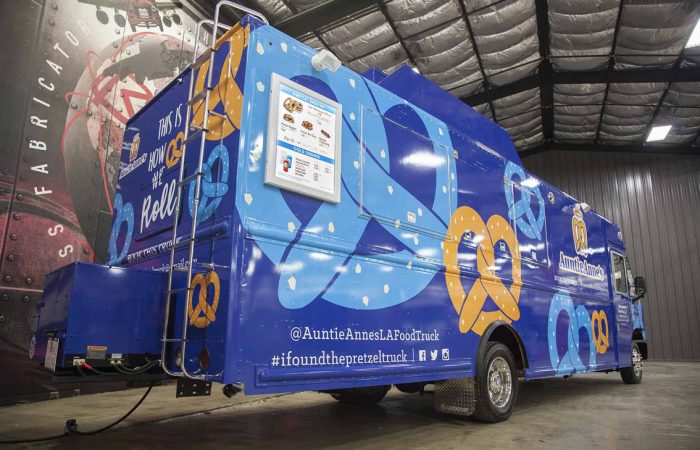 A top tier build by Cruising Kitchens expert fabrication team, the Auntie Anne's Food Truck is a custom truck that can be customized to produce high quantities while maintaining quality. With a 4 foot long blow up pretzel, this truck is perfect for any business looking to add a delicious treat to their menu.