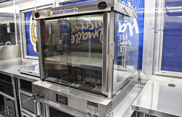 Auntie Anne's Food Truck is a top tier build by Cruising Kitchens expert fabrication team. Custom built to produce high quantities while maintaining quality using state of the art soft pretzel making equipment and topped off with a 4 foot long blow up pretzel.