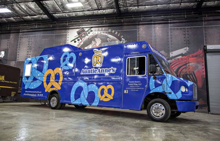 A top tier build by Cruising Kitchens expert fabrication team, this Auntie Anne's Food Truck is perfect for businesses looking to produce high quantities of quality soft pretzels. Featuring a 4 foot long blow up pretzel, this food truck can be customized to each business' specific needs.