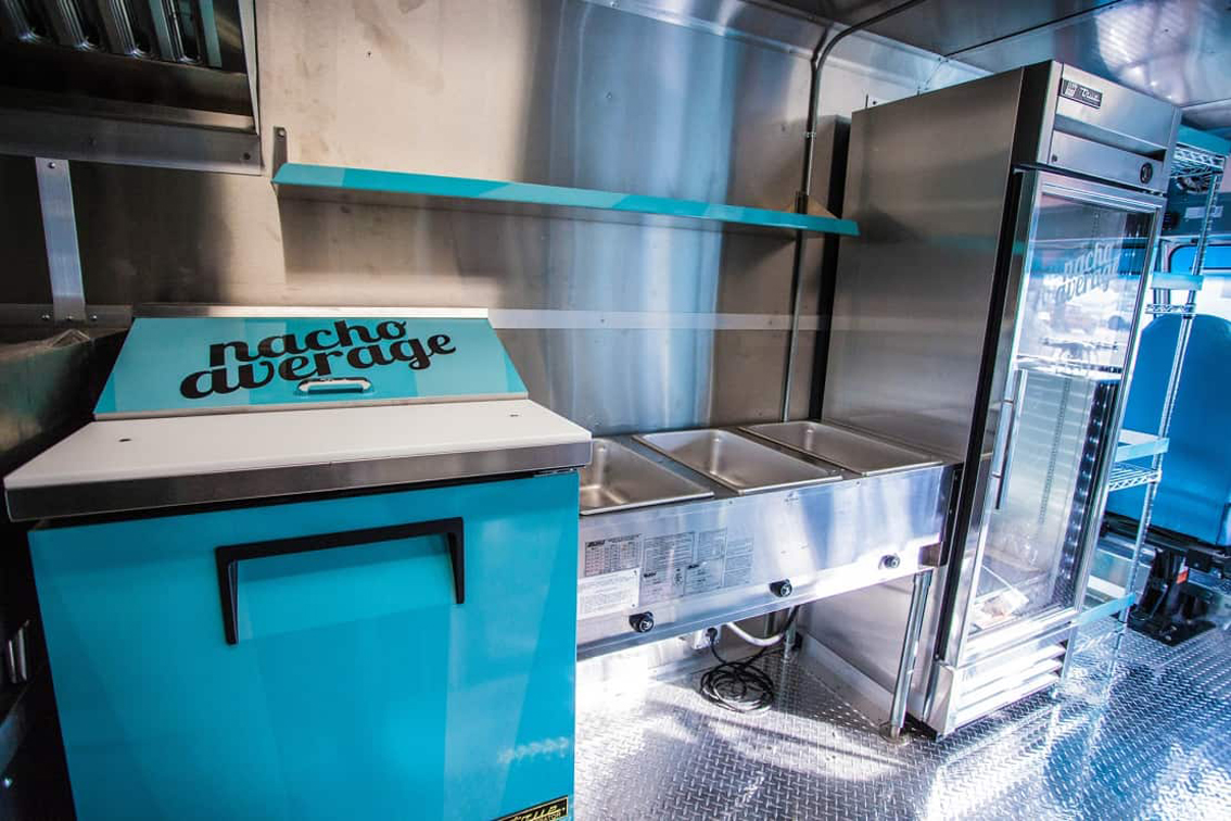 The Nacho Average Food Truck (AISD) is a custom build from Cruising Kitchens, featuring top tier equipment and a wrap designed in conjunction with the students who will benefit from the truck. For the normal lunch price, students will receive two tacos and up to three sides and a milk.