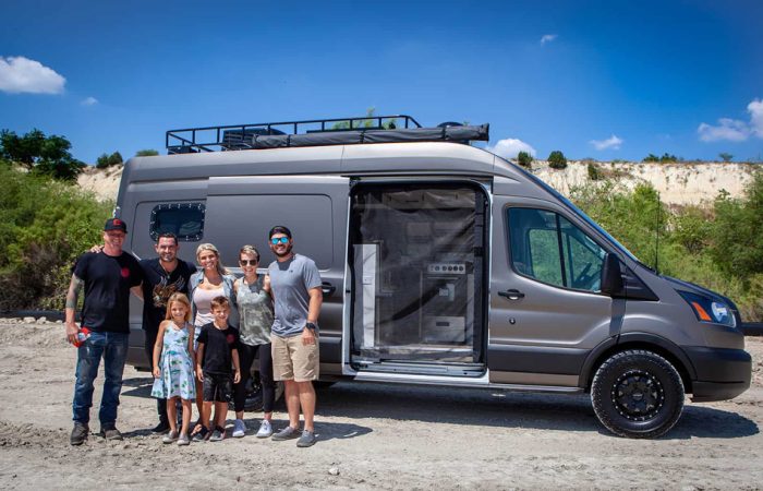 This one-of-a-kind Avril LaVan Off The Grid Overlander Van was built by Cruising Kitchens. It features a custom grill, several sasquatches, and a livable space including bed, L shaped bench seating, and state of the art micro-appliances.