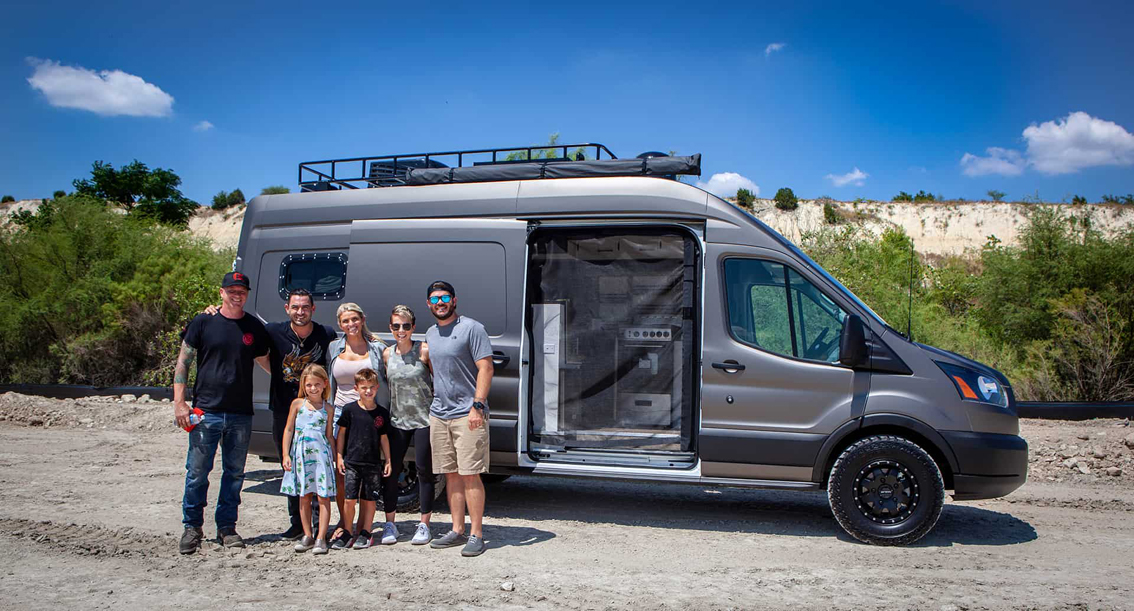 This one-of-a-kind Avril LaVan Off The Grid Overlander Van was built by Cruising Kitchens. It features a custom grill, several sasquatches, and a livable space including bed, L shaped bench seating, and state of the art micro-appliances.