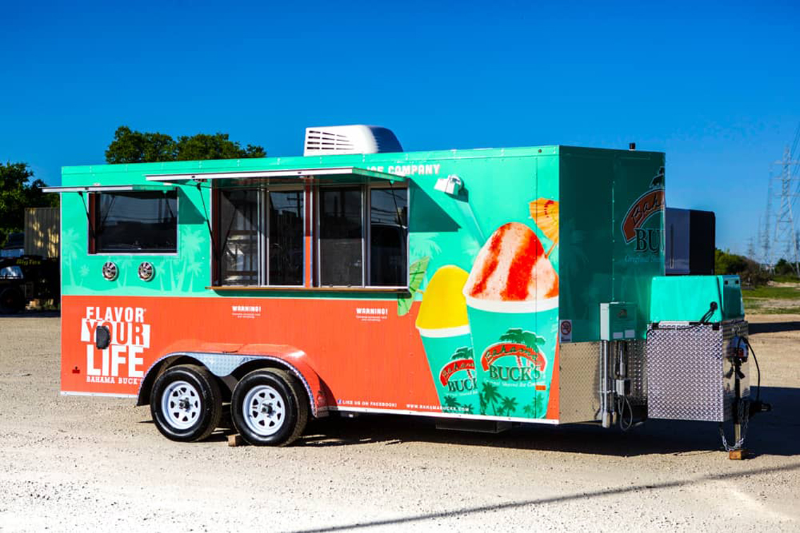 Bahama Bucks Shaved Ice Food Trailer is built by Cruising Kitchens to provide high quality shaved ice for an exceptional customer experience. With sleek diamond plating and a graphics package that screams Bahama Bucks, this trailer is the perfect place to go for a refreshing sno-cone!
