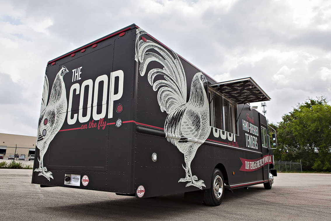 The Coop Food Truck is a custom-built food truck by Cruising Kitchens, designed for quality breaded chicken tenders at high volume. This truck has an efficient cook line with a top-of-the-line ventilation system and chicken friers.