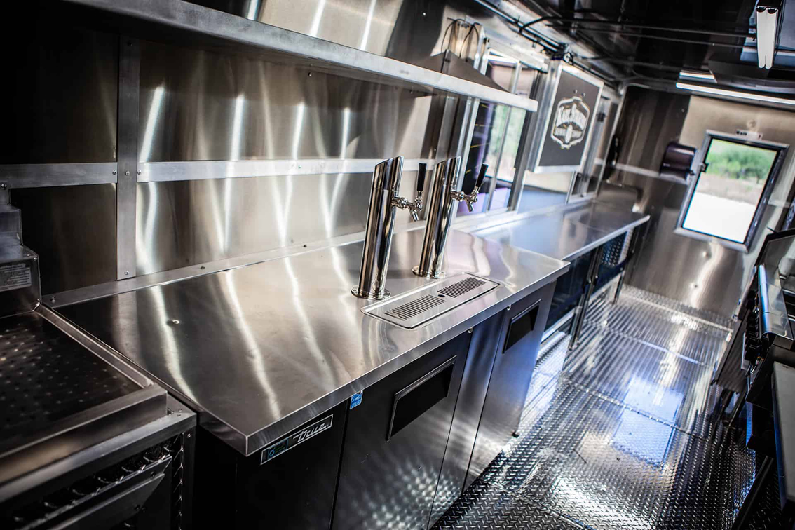 The Karl Strauss Food Truck is a custom build by Cruising Kitchens that features the Karl Strauss Brewing Company logo and the beautiful San Diego skyline. This top-of-the-line food truck comes equipped with quality commercial appliances and 2 keg taps with ice cold refrigeration, making it the perfect way to promote Karl Strauss' craft beers.