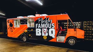 P'Lickles Famous BBQ Food Truck built by Cruising Kitchens Mobile Kitchen Food Trailer Shipping Container Kitchens Mobile Food Bank Olympic Gold Medalist Tamyra Mensah Stock